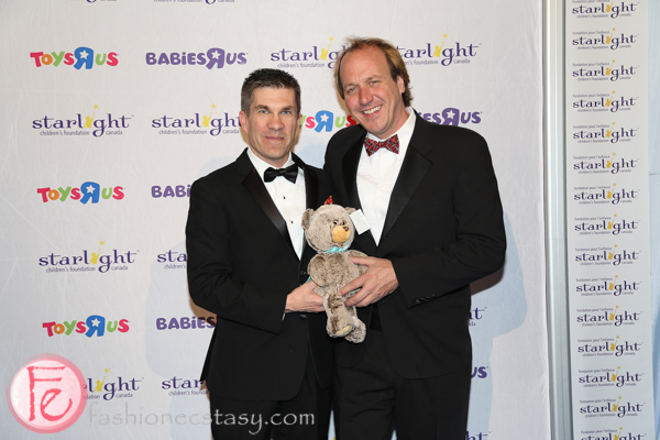 Patrick Lefrancois (Gala Chair) & Brian Bringolf (Starlight Executive Director) holding Quinn, Starlight's collectible bear